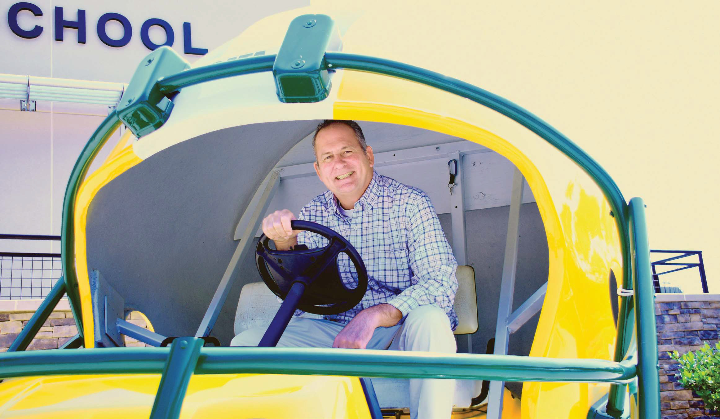 New Gatewood Head of School Jon Fadely takes a turn behind the wheel of the Gators’ football-themed golf cart, a fitting ride for the avid golfer who lives with his wife at Reynolds in Greene County. IAN TOCHER/Staff