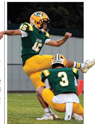 After a great snap from Cayden Burner and perfect placement by Harrison Harper (3), freshman kicker Ruben Sanchez (45) came through last Friday with the extra point for a last-second tie that sent the Gators into overtime. IAN TOCHER/File photo