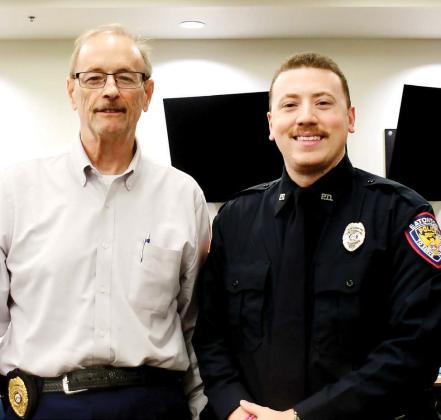 Early this month at a scheduled Eatonton City Council meeting, Eatonton Police Chief Howell Cardwell (left) introduced Officer Mitch Jimenez to council members as his latest addition to the force. Jimenez told council members he’s enjoying the job here and looks forward to helping others and getting involved locally. IAN TOCHER/Staff