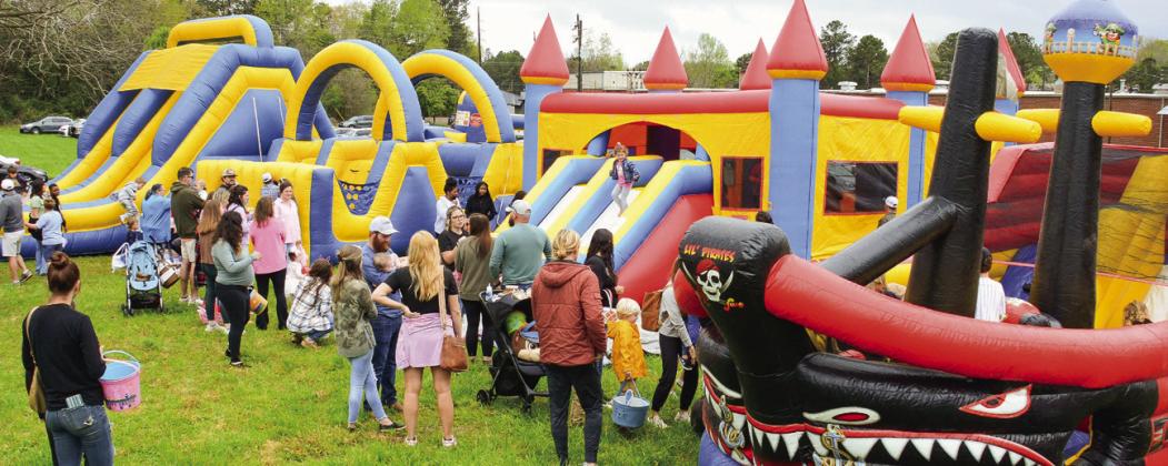 Kids had the choice of four bouncy houses from two big slides, an obstacle course, and a pirate ship. IAN TOCHER/Staff