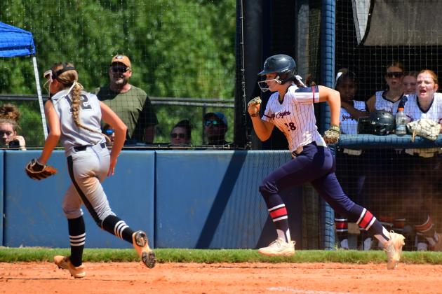 Kaitlyn Witcher charges toward home plate during Putnam County’s home doubleheader against Tallulah Falls on Aug. 22. IAN TOCHER/Staff