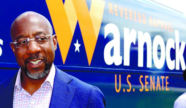IAN TOCHER/Staff Sen. Raphael Warnock rolled into town Aug. 18 and spent a few minutes in front of Eatonton’s historic court house before giving a speech at nearby Ebenezer Baptist Church.