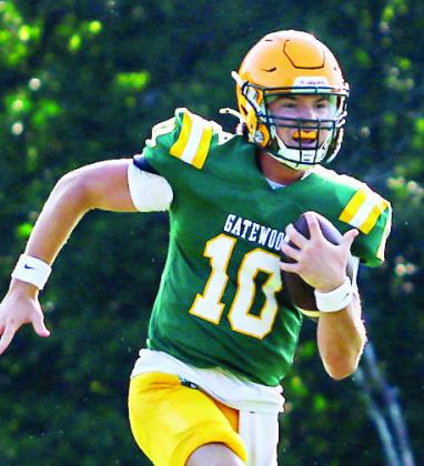 Gatewood quarterback Blake Brannen scrambles out of the pocket for a first down against Edmund Burke. TREY NORRIS/Staff