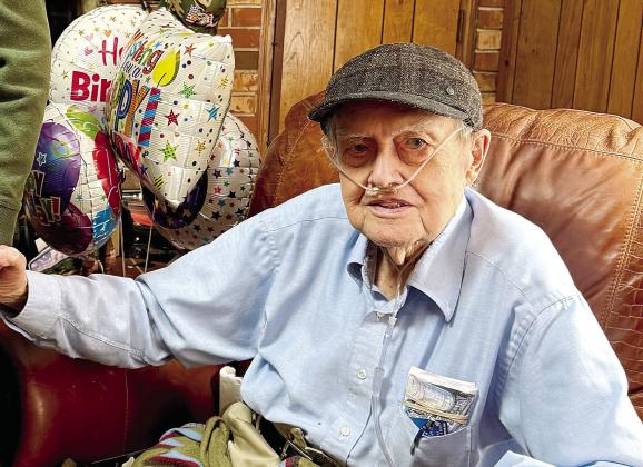 James Dooley is all smiles for his 100th birthday Friday. LYNN HOBBS/Staff