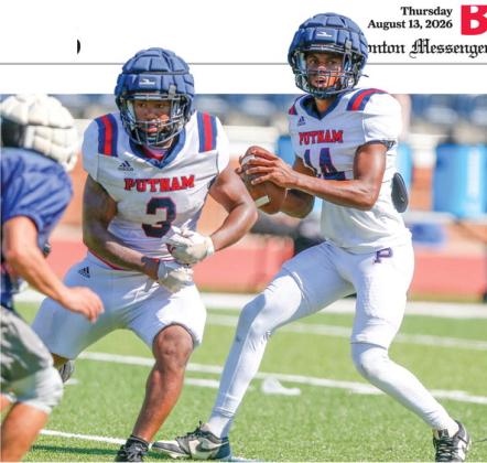 Putnam County quarterback Caleb Reeves (14) drops back in the pocket with running back Elijah Dunn (3) providing pass protection during a padded camp in Eatonton last month. LANCE McCURLEY/Staff