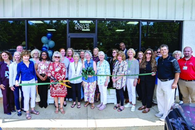 St. Mary's Retail Operations Manager Angie Patterson prepares to cut the ribbon to open St. Mary's Good Samaritan Hospital Upscale Thrift Store in 2025. Photo courtesy of Brock Company Creative CONTRIBUTED