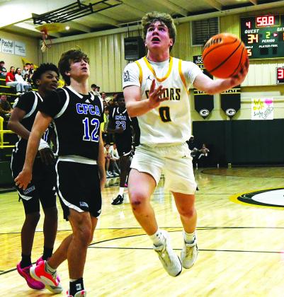 IAN TOCHER/Staff  Then an eighth grader, Bennett Haley attempts a layup through traffic during a game in the 2025-26 season.