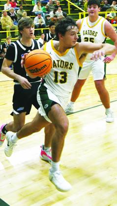 Landon Moreno drives the baseline past a defender during a game in the 2025-26 season. IAN TOCHER/Staff