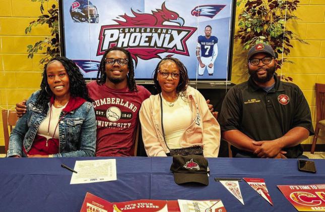 Putnam County’s RJ Hines (second from left) recently signed to continue his football career at Cumberland University. CONTRIBUTED