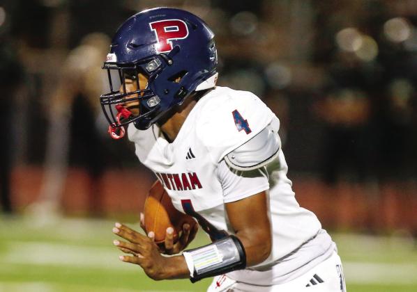 Putnam County junior quarterback Caleb Reeves had a big night for the War Eagles in their Aug. 28 win over Hancock Central. LANCE McCURLEY/Staff