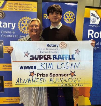 Rotarian and Rotary Area Governor Jennifer Pennington was joined by Rotary GRSP student Camilo Pareja of Columbia in presenting to Rotary Raffle Week 39 winner Kim Logan, who was not available for the photo, a pair of Apple AirPods and a fourpack of Apple AirTags valued at $350 total and sponsored by Advanced Audiology. CONTRIBUTED