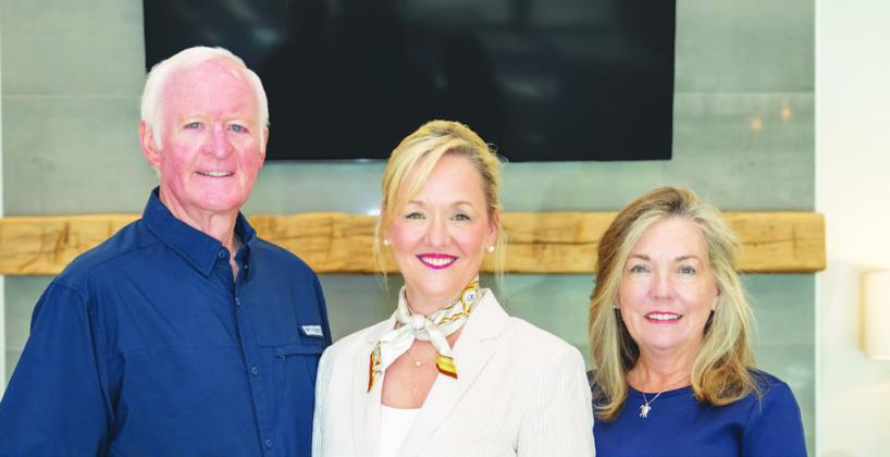 Reynolds Lake Oconee Properties sales leaders Scott Hoersten and Mary Luster (right) joined 16time Sales Executive of the Month Traci Johnson for a celebratory photo. CONTRIBUTED