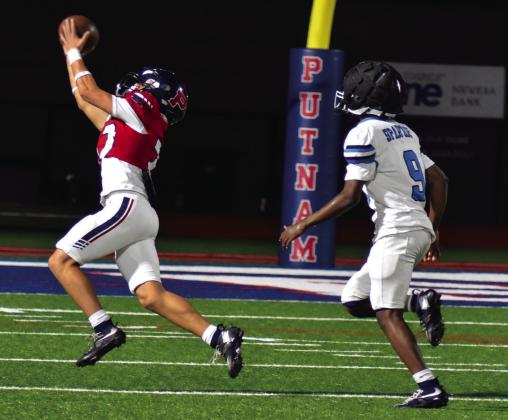 Wideout Elijah Kelly is able to reach out and pull in a pass from quarterback Caleb Reeves in the rain last Friday night against the Glenn Hill Spartans. BRANDON PARK/Staff