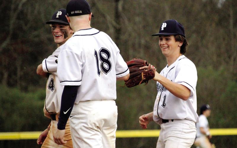 Wade Johnston (18) and Wyatt Simms (1) celebrate after a force out in the infield. TREY NORRIS/Staff