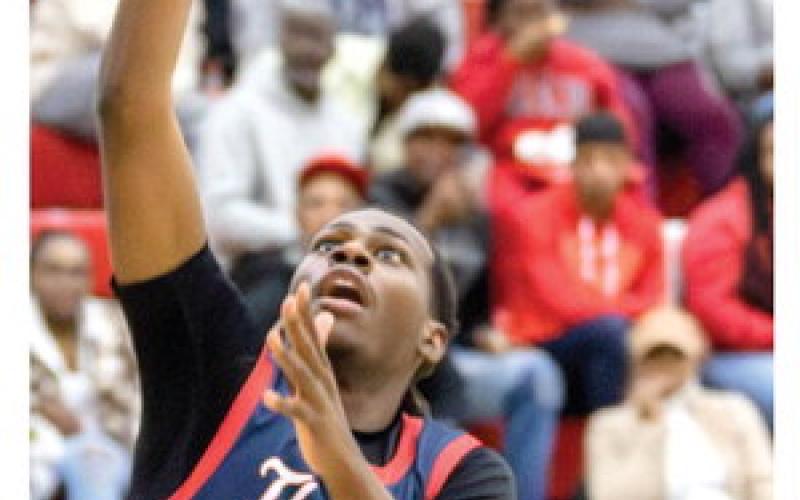 Putnam County boys senior forward Shamar McClendon goes up for a layup inside the paint. LANCE McCURLEY/Staff