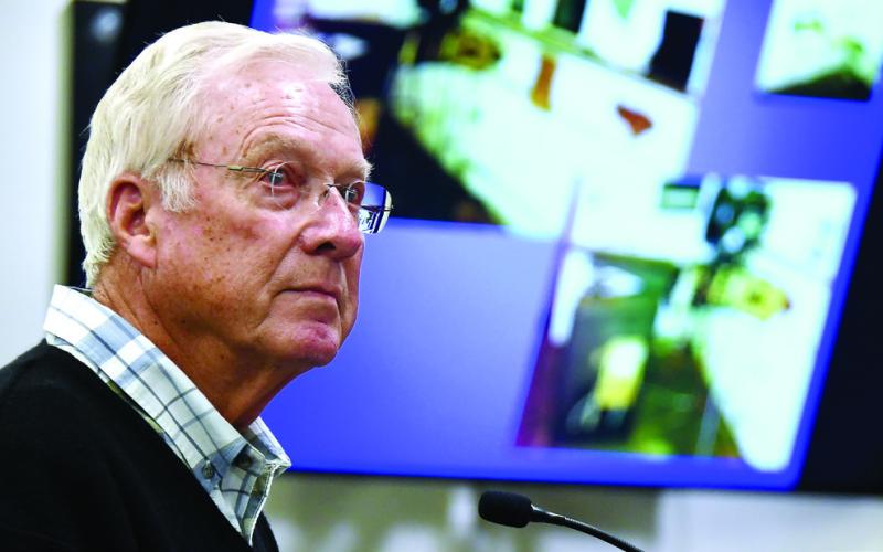 Harold DeLoach with images of the interior of Eatonton’s PEX Theater on the screen behind him. IAN TOCHER/Staff