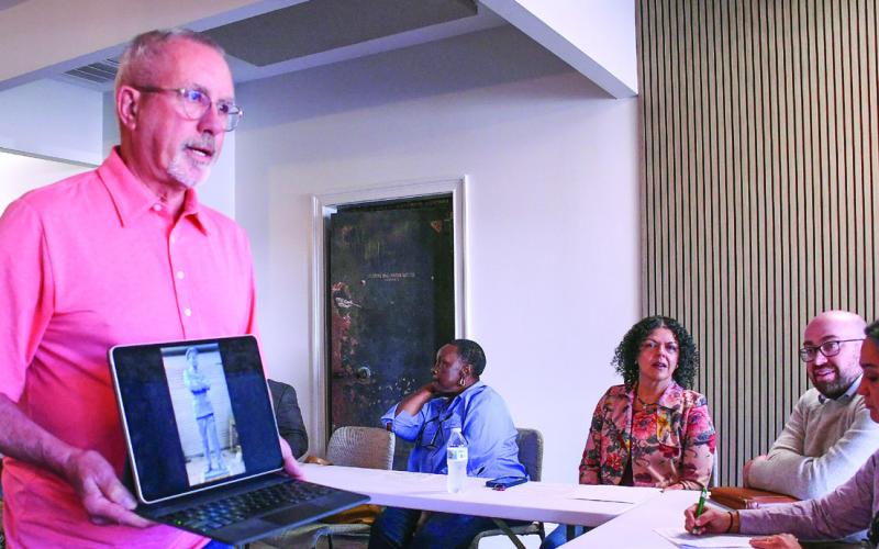 Kevin Tomson Hooper of The Artisans Village displayed to the EPTAH group a laptop image of the statue being created by worldrenowned sculptor Basil Watson of Eatonton native and Tuskegee Airman Col. Hiram Little Sr. IAN TOCHER/Staff