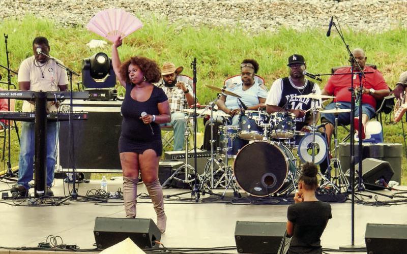Macon-based Blak Pearl had the Eatonton crowd up and dancing into the evening on Saturday with an energetic combination of original and cover tunes. GORDON COLUMBINE/Staff
