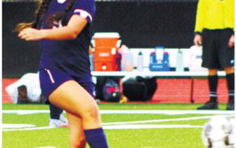 Leslye Arriola (11) kicks the ball from midfield to a teammate. KIM CASH/Staff