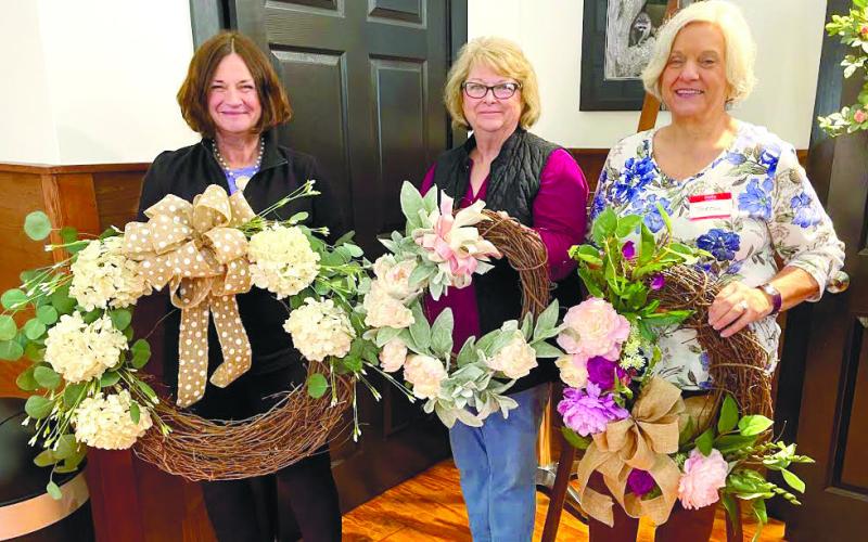 Rebecca McRobbie, Teresa Schultz and Linda Base Moore enjoy the Spring Wreath Class.