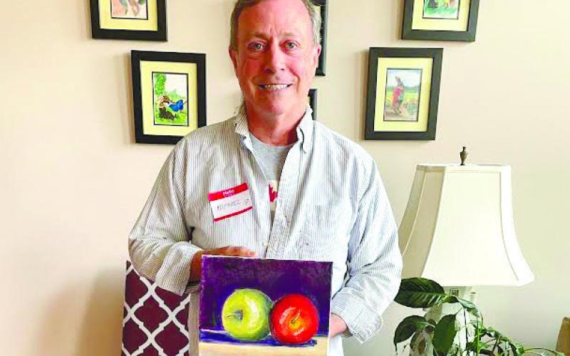 Artisans Village student Michael Homeier shows o_ his Beginning Oil Painting project.