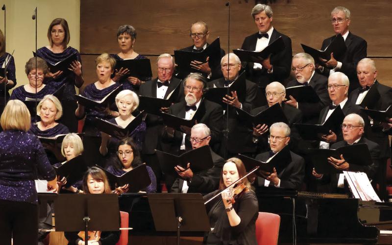 Members of the chorus in song.