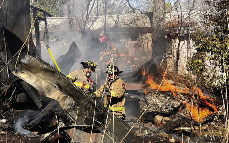 Both Eatonton and Putnam County firefighters responded to Wednesday’s blaze on Mulberry Street in Eatonton. IAN TOCHER/Staff