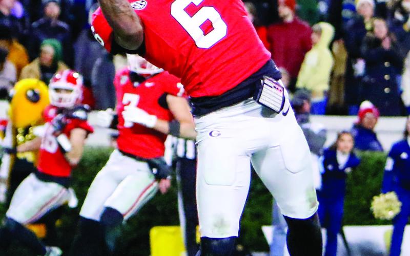 Georgia wide receiver Dominic Lovett (6) hauls in a touchdown with under a minute left of the fourth quarter, leading to kicker Peyton Woodring tying the game with the extra point. LANCE McCURLEY/Staff