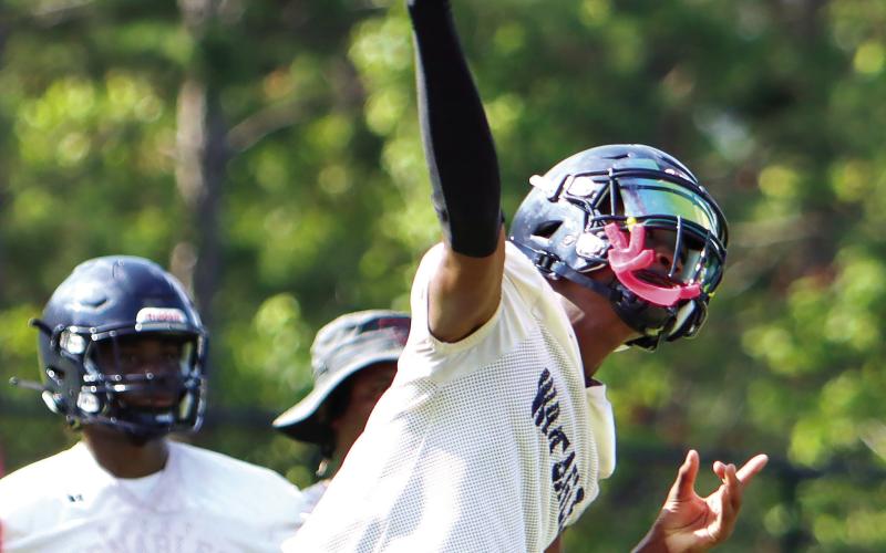 Putnam County quarterback Jamarion Robertson drops back to pass during a camp in July. Putnam head coach Joel Harvin said Robertson took most of the first-team snaps in last week’s scrimmage. LANCE McCURLEY/Staff