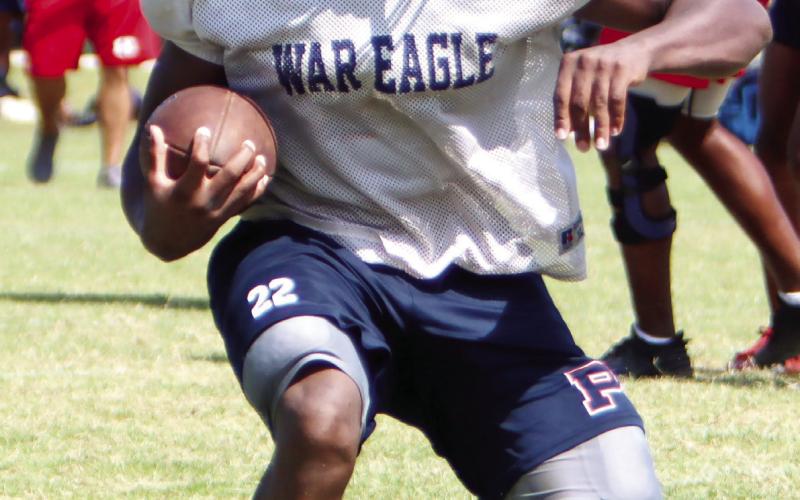 Putnam County running back Omarion Butts (22) during a padded camp in July. War Eagles’ head coach Joel Harvin said Butts played well in this past Friday’s scrimmage. LANCE McCURLEY/Staff