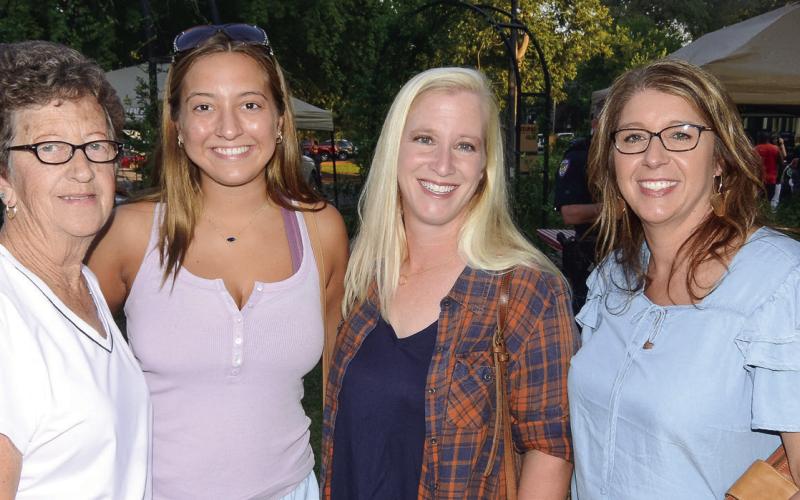 L-R: Putnam County locals Joyce Harper, her granddaughter Lauren Harper, her niece Jill Boyer, and friend Natalie Holle enjoyed the food and music at Taste of Eatonton. LEIGH LOFGREN/Staff