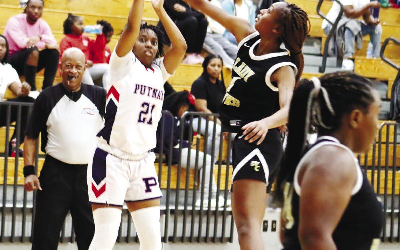 PCHS leading scorer Kamyra Aikens (21) goes up for a 3-pointer. ARELLA CASH/Staff