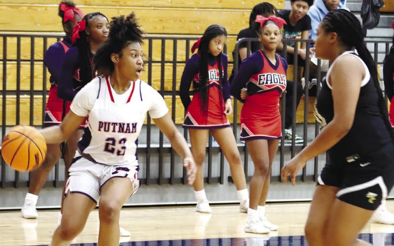 Freshman Zy Williams (23) looks for the pass an open Lady Eagles shooter. ARELLA CASH/Staff