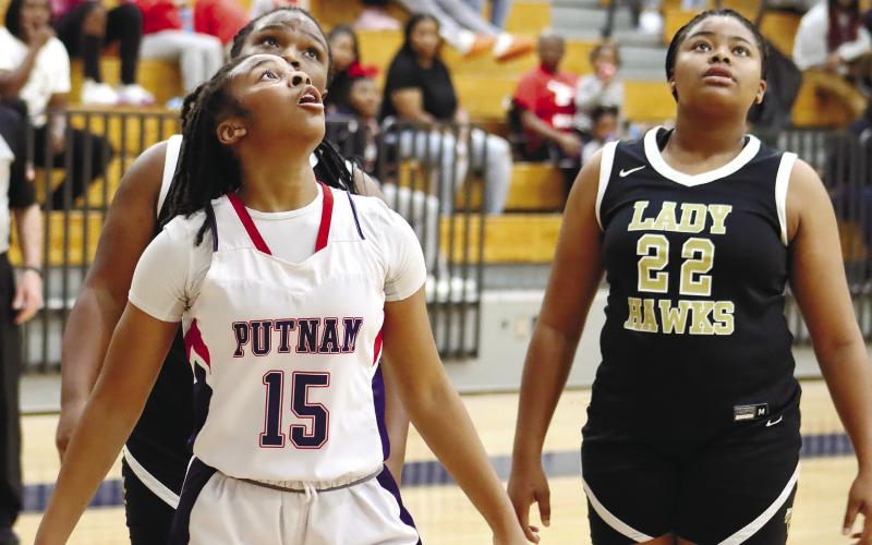 PCHS freshman Mel Richardson (15) waits on a rebound alongside Washington County’s Makayla Dunn (22) last week.  ARELLA CASH/Staff