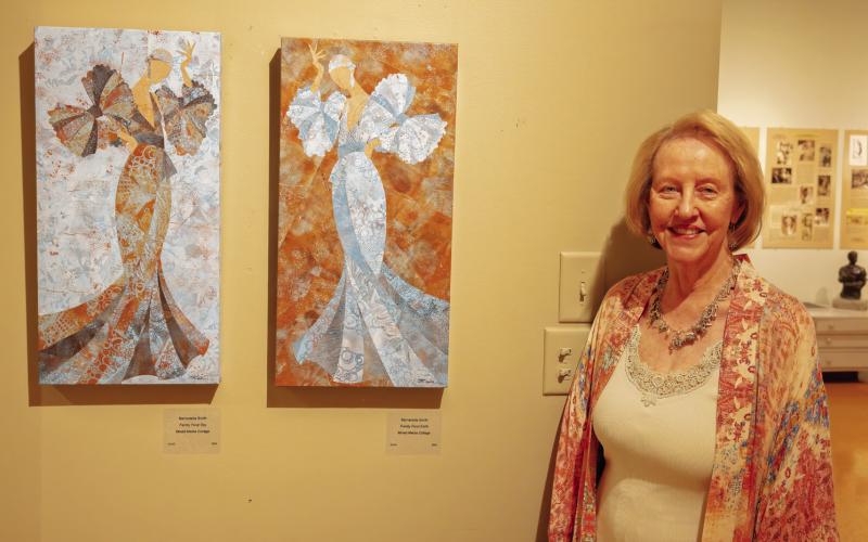 The daughter of Steffen Thomas and Sara Douglass Thomas, Lisa Conner with some of the artwork in the museum. LEIGH LOFGREN/Staff