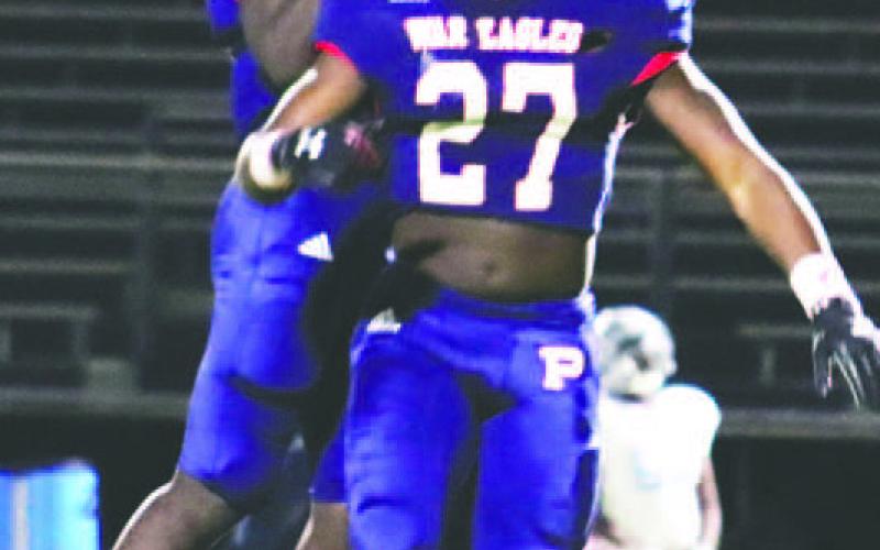 Tamarion Peters (27) celebrated with a teammate after scoring a TD against Glenn Hills. ARELLA CASH/Staff