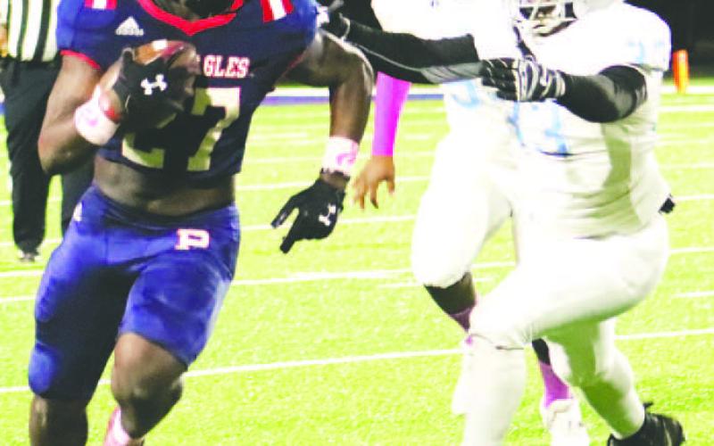 Peters runs past a Spartan defender for a chunk gain. ARELLA CASH/Staff