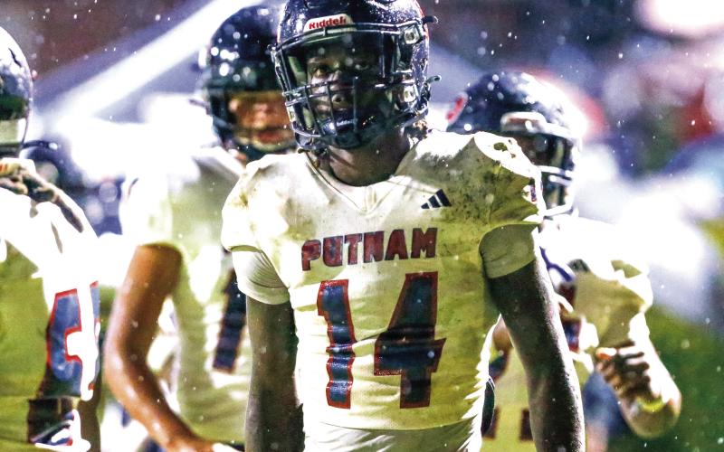 Putnam County senior wide receiver Jayson Smith (14) took a reverse and scored the game-winning touchdown against Haralson County this past Friday. LANCE McCURLEY/Staff