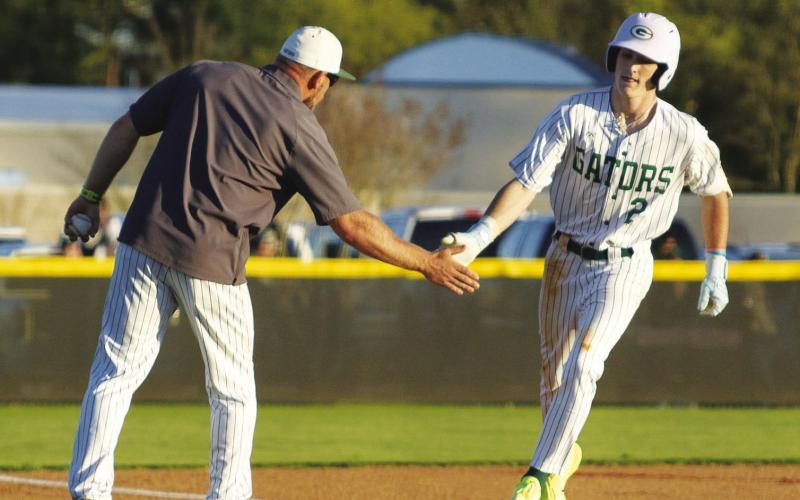 Gatewood senior Ben Brannen rounds the bases after hitting his first home run of the season on March 13 against Trinity Christian. TREY NORRIS/Staff