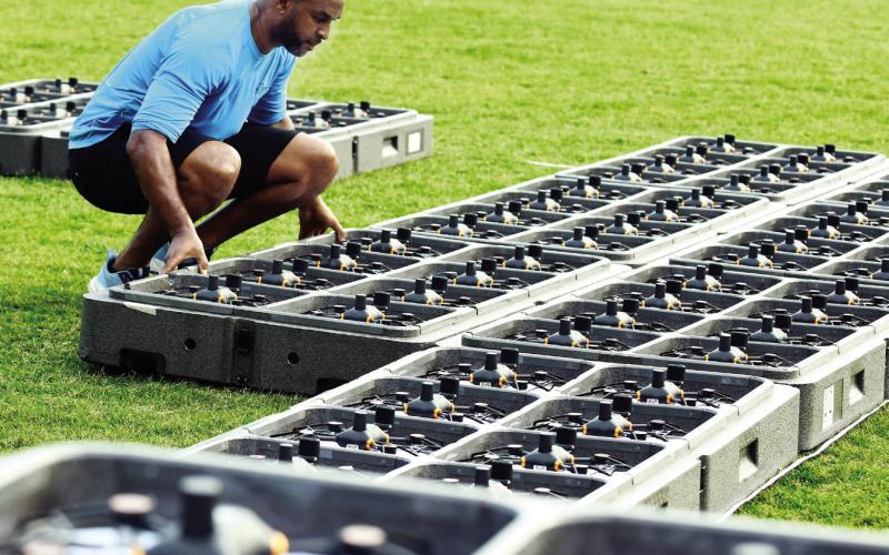 Arturo Lorde, who served as the evening’s show pilot, checks and prepares some of the 400 lighted drones that put on a patriotic show last Friday night in Eatonton. IAN TOCHER/Staff