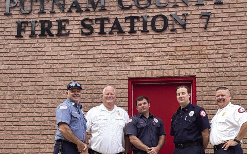 Putnam County Fire Chief Thomas McClain (second from left) welcomes firefighters to Station 7 in the Long Shoals area of the county. CONTRIBUTED