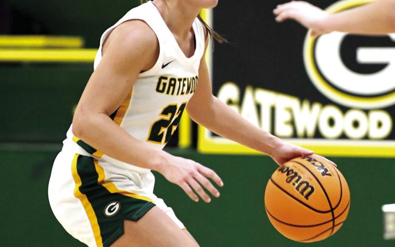 Senior Natalie Sills brings the ball up the court for the Lady Gators in a game earlier this season. IAN TOCHER/Staff