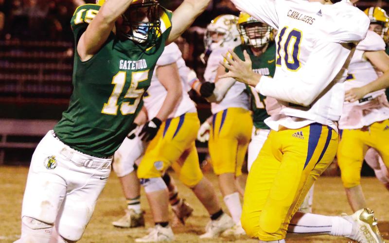 Gators’ senior Lawson Wooten, shown here deflecting a pass attempt by freshman APD quarterback Carter Chavous, had a great game on both sides of the ball for Gatewood Friday night. IAN TOCHER/Staff