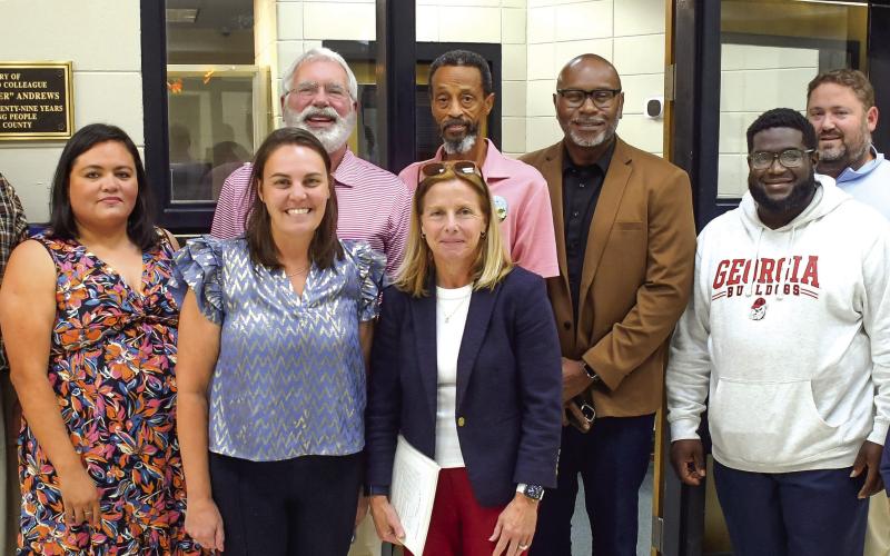 L-R: City Attorney Chris Huskins, City Clerk Maria Jiminez, Wards 1&amp;amp;4 Councilor Marie Rainey, Mayor Pro-Tem Chip Walker, Ward 4 Councilor Teresa Doster, Ward 2 Councilor James Gorley, Wards 2&amp;amp;3 Councilor Michael Smith, Ward 3 Councilor Fred Lowe, City Administrator Gary Sanders, and Ward 1 Councilor Mylle Mangum had the honor of holding the first official meeting in Eatonton’s new city hall last Tuesday evening. IAN TOCHER/Staff