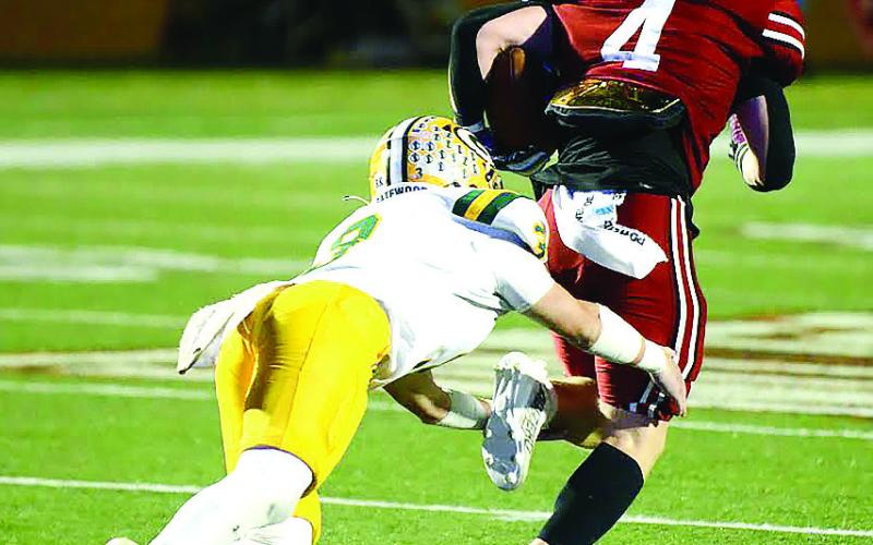 Gatewood’s Jackson Hewatt very likely prevented an end-to-end touchdown by Edmund Burke’s Owen Redd (4) in the dying moments of the game after Redd intercepted a potential game-winning pass meant for Hewatt just a couple of yards from the EBA end zone. IAN TOCHER/ Staff
