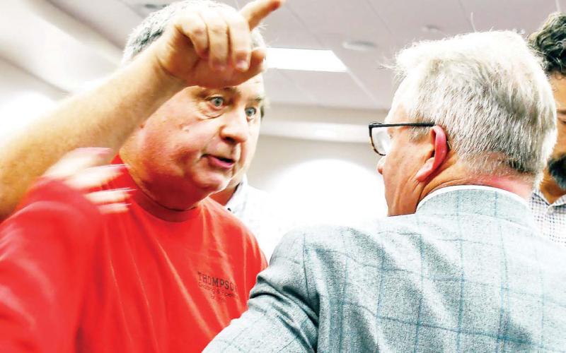 Putnam County resident Mark Thompson addressed Jay Putnam County Stone lawyer Jay Dell as the P&amp;amp;Z meeting broke up last Thursday night. IAN TOCHER/Staff