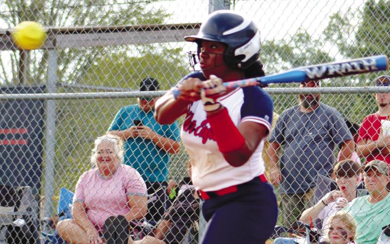 Taylor Eubanks gets a hit to put her on base for Lady Eagles Softball against Lainey.