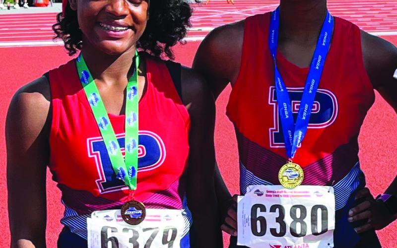 Faith Watkins (left) and Aubree Butts (right) were the only Putnam County girls track and field athletes to qualify for the GHSA Class A Division I state meet. CONTRIBUTED