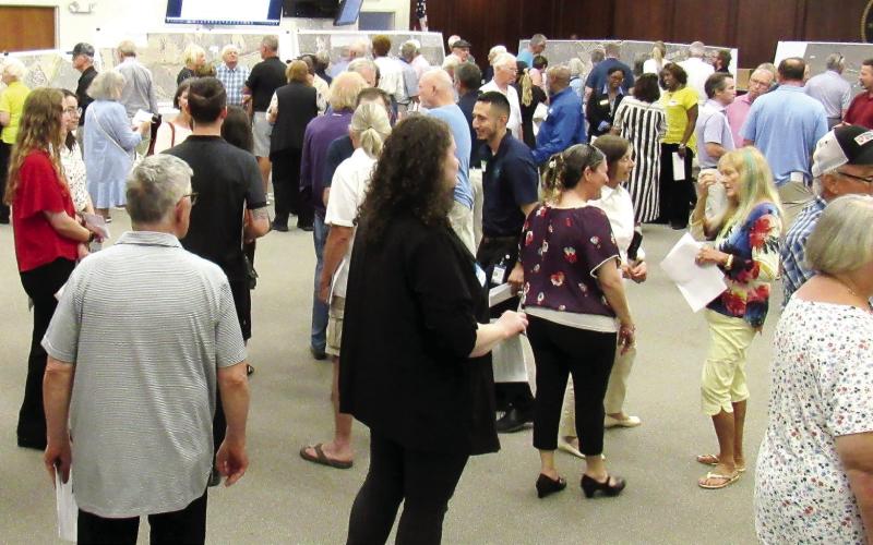 Residents, business owners and community leaders attended the GDOT open house at the Putnam County Administration building on Tuesday, May 7 to see the latest plans for the widening of Highway 44. The project could start early next year. MARK ENGEL/Staff