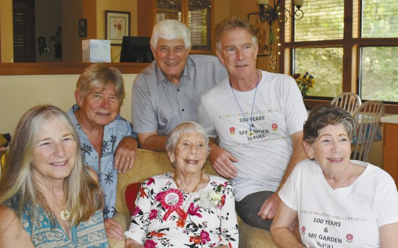 Sandy Mallinson (center), an Eatonton resident since 1989, celebrated her 100th birthday Oct. 6, surrounded by her five children (l-r: Mary Long, Steve, Ed, and David Mallinson, and Jane Paulin) along with her large extended family. CONTRIBUTED BY DEBBIE MALLINSON